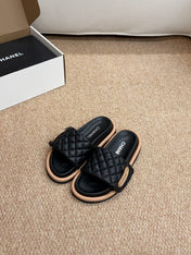 CHANEL 26S SLIDE SANDALS IN BLACK QUILTED CALFSKIN WITH LOGO PLAQUE