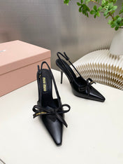 MIUMIU 26S SLINGBACK PUMPS 105MM IN BLACK CALFSKIN WITH BOW