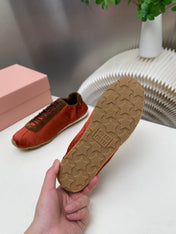 MIUMIU 26S SNEAKERS IN RUST RED PLUME SATIN