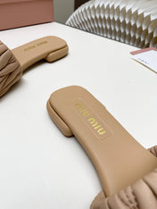 MIUMIU 26S MATELASSE SLIDES IN BEIGE CALFSKIN