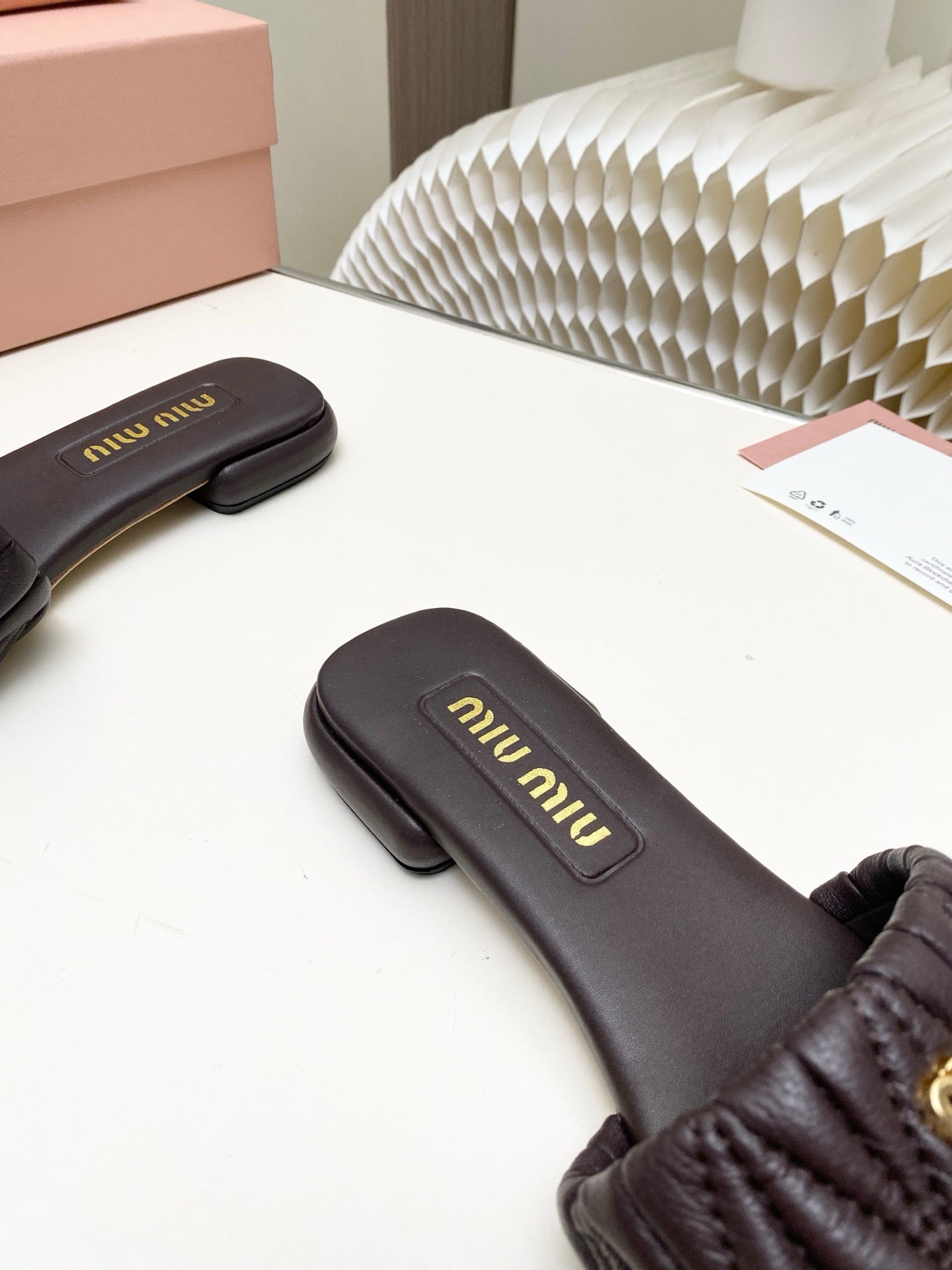 MIUMIU 26S MATELASSE SLIDES IN DARK BROWN CALFSKIN
