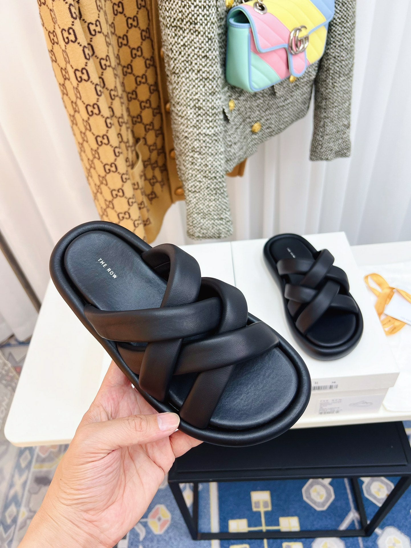 THE ROW 26S CROSSED PADDED SLIDES IN BLACK CALFSKIN