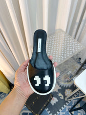THE ROW 26S PIXEL APPLIQUE MULES IN BLACK CALFSKIN