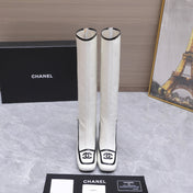 CHANEL 26S KNEE HIGH BOOTS 80 MM IN WHITE CALFSKIN WITH BLACK PATENT LEATHER TRIM AND CC LOGO ON TOE CAP