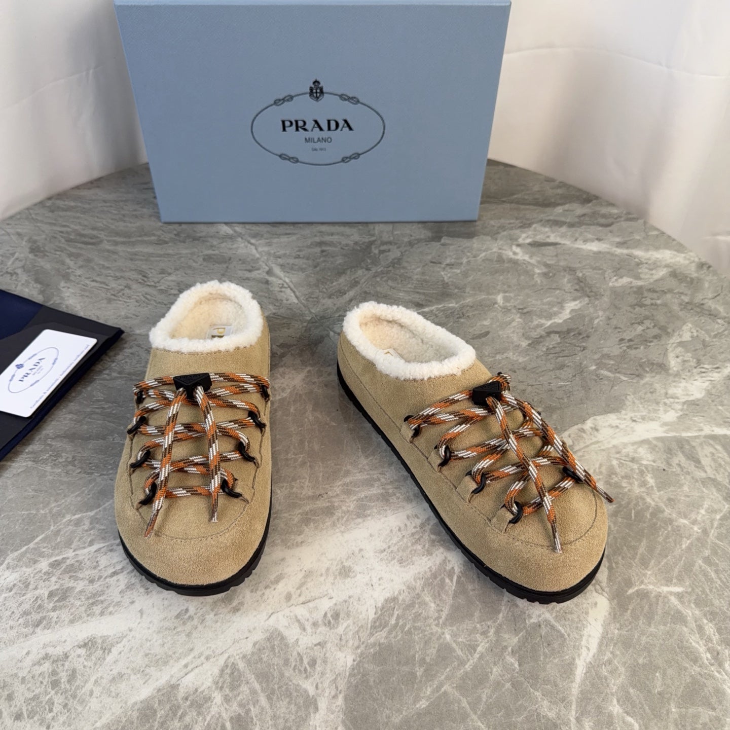 PRADA 26S WOVEN MULES IN DARK BEIGE SUEDE