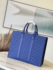 SAC PLAT 24H 41 IN SAPPHIRE BLUE MONOGRAM EMBOSSED TAURILLON