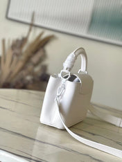 CAPUCINES EAST-WEST MINI 21 IN WHITE TAURILLON