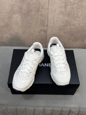 CHANEL 26S RUNNER CC LOGO SNEAKERS IN WHITE CALFSKIN