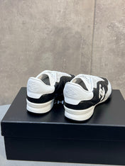 CHANEL 26S SNEAKERS IN BLACK AND WHITE QUILTED CALFSKIN CC LOGO