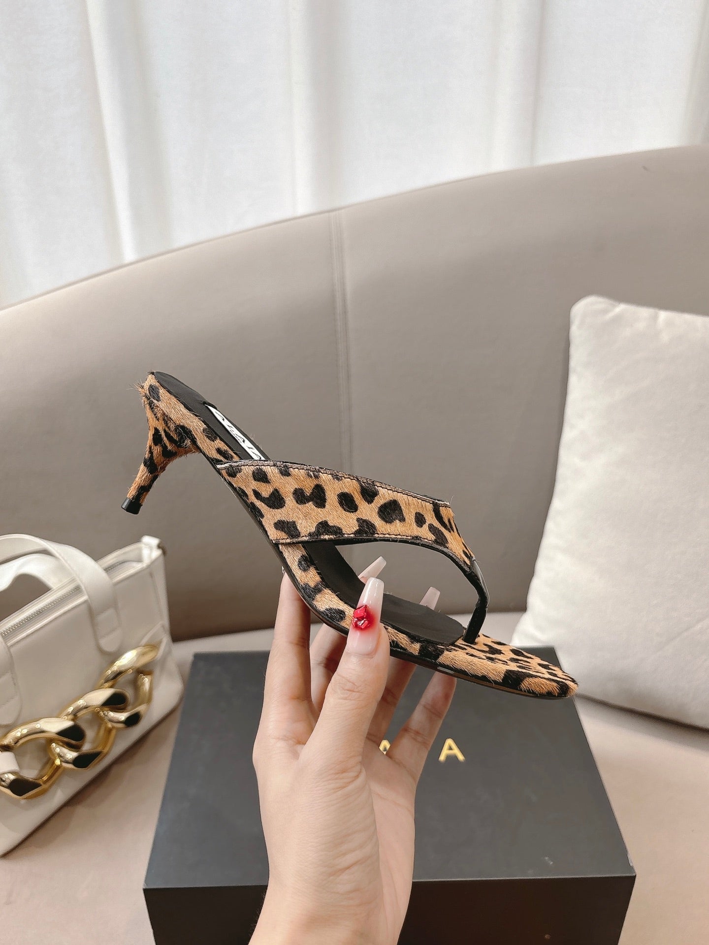 ALAIA HEELED THONG 25S 55 MM IN LEOPARD PONY HAIR LEATHER