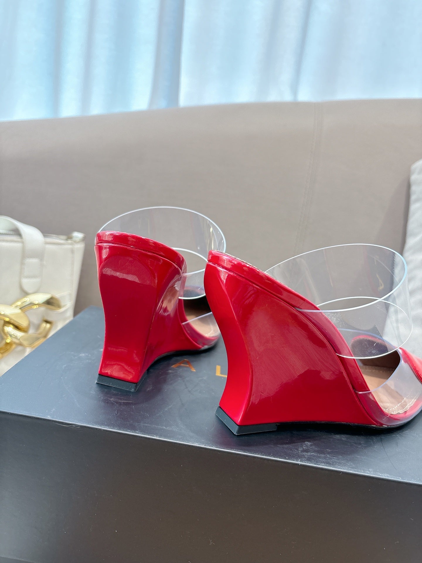 ALAIA 26S HIGH-HEEL WEDGE MULES 95 MM IN RED GLOSSY CALFSKIN