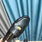MULES SLIPPERS BLACK COWHIDE WITH GOLD COIN