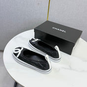 CHANEL 26S CC LOGO SLIP-ON SNEAKERS IN BLACK CALFSKIN