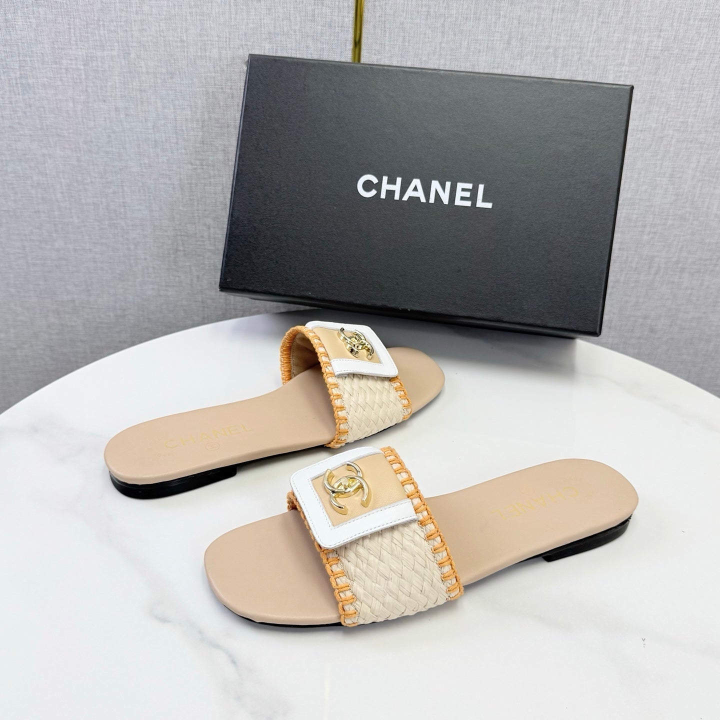 CHANEL 26S WOVEN STRAP SLIDES IN BEIGE AND ORANGE LAMBSKIN