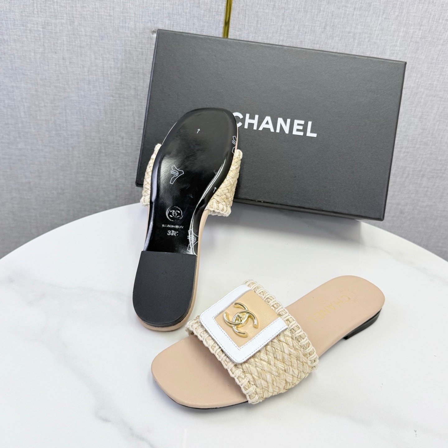 CHANEL 26S WOVEN STRAP SLIDES IN BEIGE LAMBSKIN