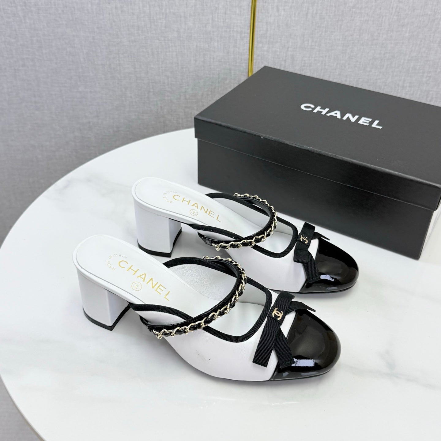 CHANEL 26S HIGH HEEL MULES 45 MM IN WHITE AND BLACK LAMBSKIN