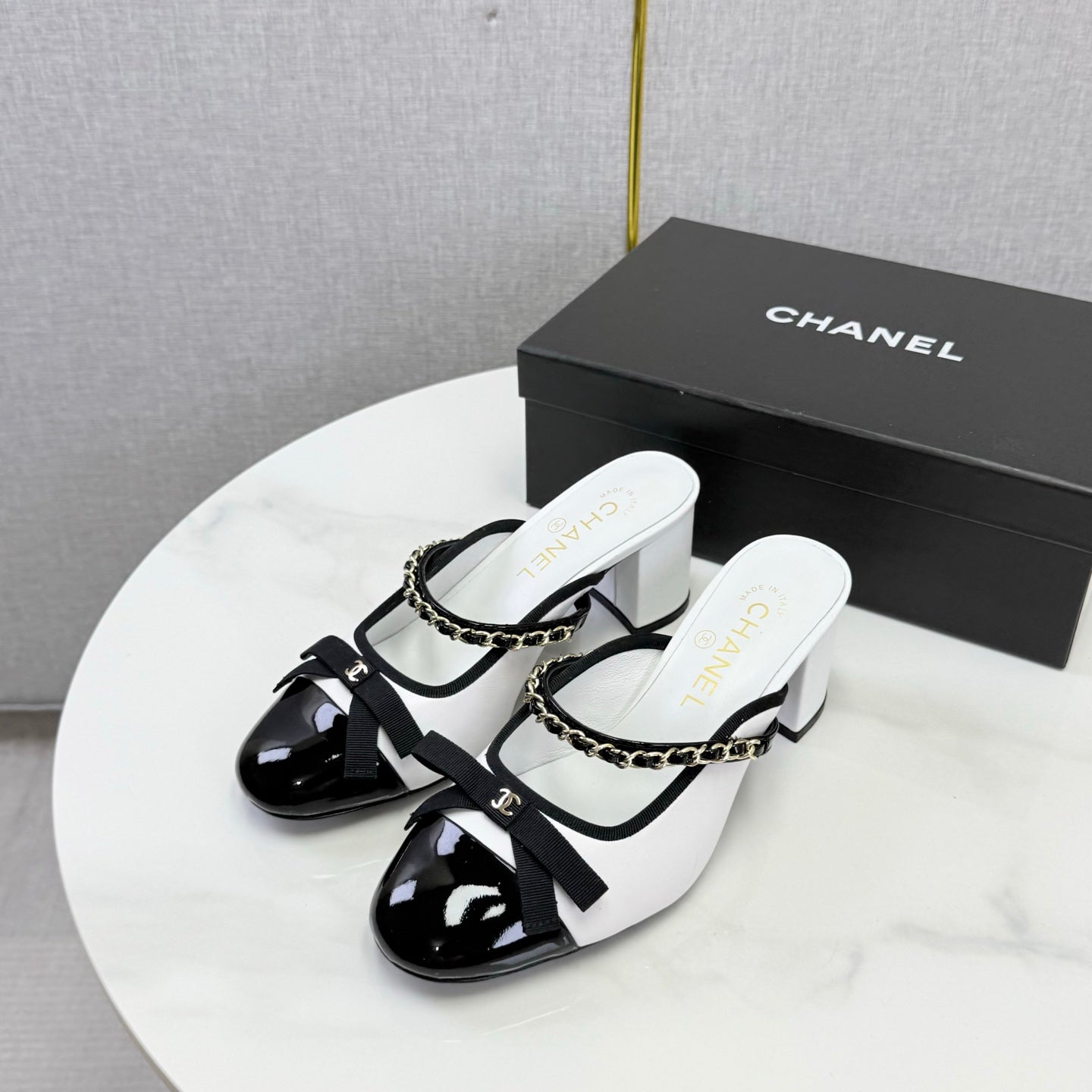 CHANEL 26S HIGH HEEL MULES 45 MM IN WHITE AND BLACK LAMBSKIN