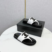 CHANEL 26S CC THONG SLIDES IN WHITE AND BLACK LAMBSKIN