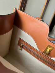 CABAS 37 IN WHITE CANVAS AND BRONZE BROWN CALFSKIN TRIM GOLD LOCK