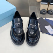 PRADA 26S LOAFERS IN BLACK CALFSKIN WITH LOGO SILVER HARDWARE