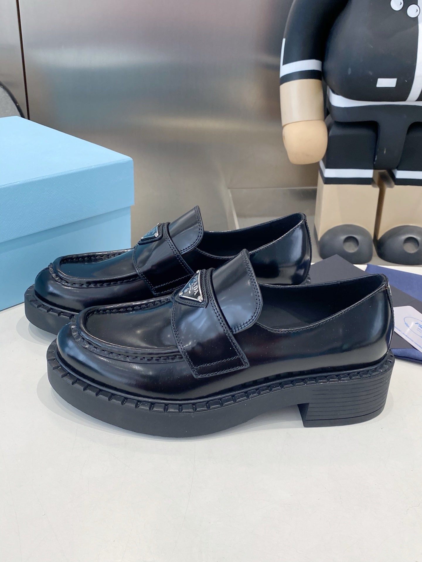 PRADA 26S LOAFERS IN BLACK CALFSKIN WITH LOGO SILVER HARDWARE