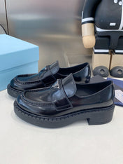 PRADA 26S LOAFERS IN BLACK CALFSKIN WITH LOGO SILVER HARDWARE
