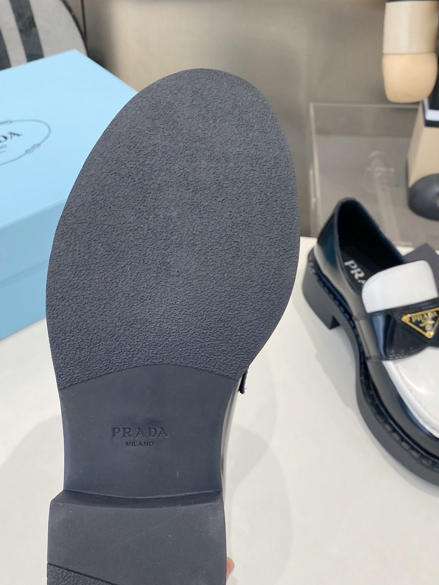 PRADA 26S LOAFERS IN BLACK AND WHITE CALFSKIN WITH LOGO