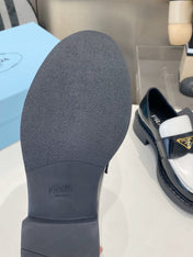 PRADA 26S LOAFERS IN BLACK AND WHITE CALFSKIN WITH LOGO