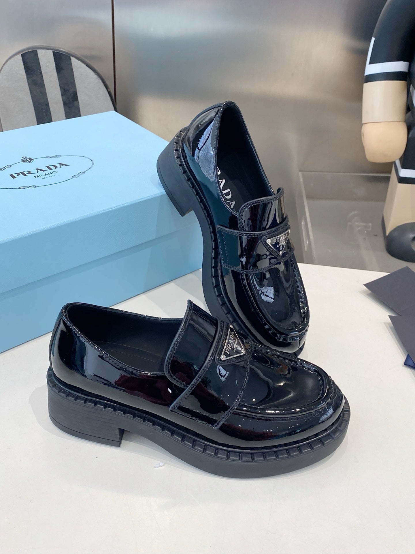 PRADA 26S LOAFERS IN BLACK PATENT CALFSKIN WITH LOGO
