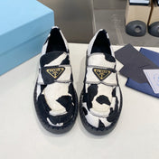 PRADA 26S LOAFERS IN WHITE AND BLACK COW PRINT PONY HAIR