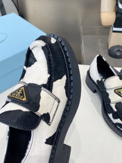 PRADA 26S LOAFERS IN WHITE AND BLACK COW PRINT PONY HAIR
