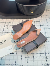 ALAIA FLAT SLINGBACK IN BEIGE BISQUE PATENT CALFSKIN AND FILM