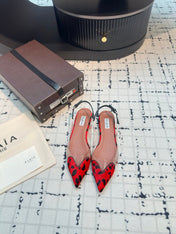 ALAIA FLAT SLINGBACK IN CHERRY RED PATENT CALFSKIN AND FILM