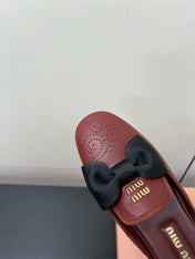 BOW MULES IN RED BROWN SHEEPSKIN