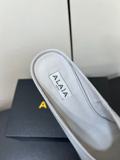 ALAIA WEDGE MULES 25S IN WHITE LAMBSKIN
