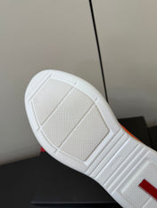 PRADA 26S SNEAKERS IN ORANGE PATENT CALFSKIN AND WHITE MESH