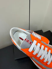 PRADA 26S SNEAKERS IN ORANGE PATENT CALFSKIN AND WHITE MESH