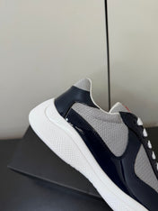 PRADA 26S SNEAKERS IN NAVY BLUE PATENT CALFSKIN AND WHITE MESH