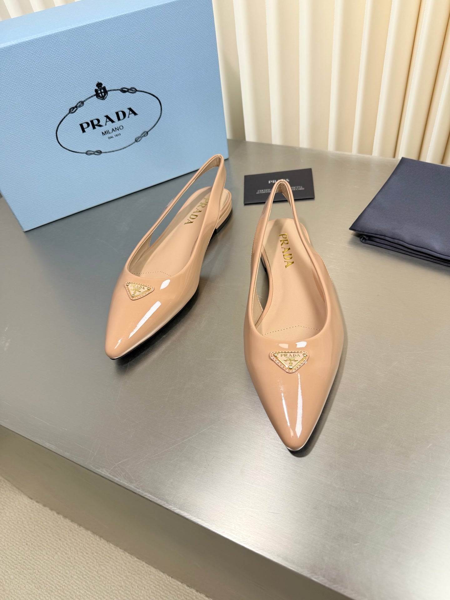 PRADA 26S SLINGBACK FLATS IN BEIGE PATENT CALFSKIN WITH GOLD HARDWARE