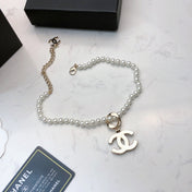 CHANEL 26S CHANEL CC LOGO PEARL BEADED NECKLACE WITH CHARM DETAIL IN GOLD METAL 633323