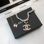 CHANEL 26S CHANEL CC LOGO PEARL BEADED NECKLACE WITH CHARM DETAIL IN GOLD METAL 633323