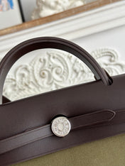 ZIP CABINE 31 BAG IN OLIVE GREEN CANVAS AND BLACK CALFSKIN
