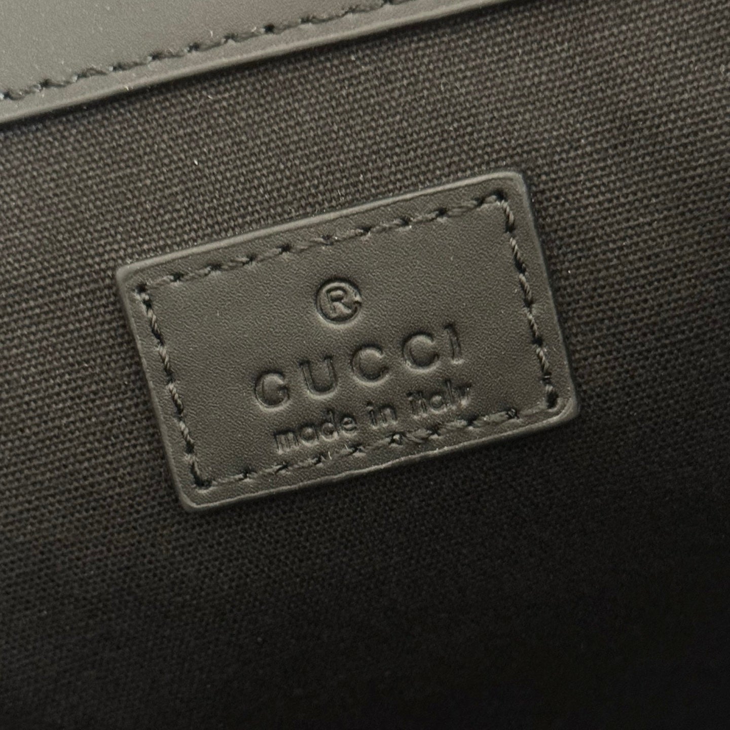 GUCCI 26S GG EMBLEM BACKPACK 44 IN BLACK EMBOSSED CALFSKIN