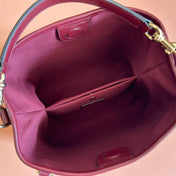 GUCCI 26S GG EMBLEM BUCKET BAG 19 IN DARK RED COATED FABRIC