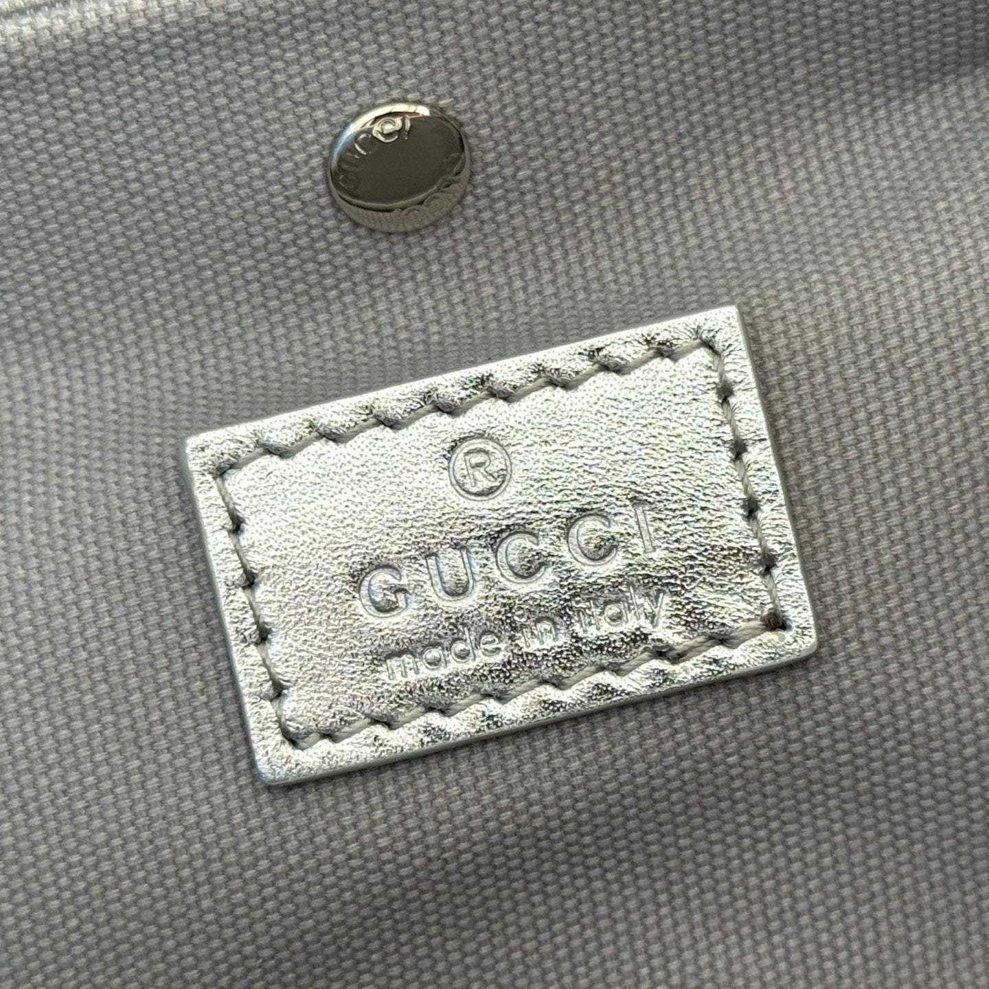 GUCCI 26S GG EMBLEM BUCKET BAG 19 IN BEIGE AND SILVER CANVAS