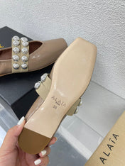 ALAIA MARY JANE PEARL IN GLOSSY BEIGE LAMBSKIN