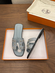 HM 26S ORAN STUDDED SANDALS IN DUSTY BLUE CALFSKIN