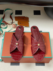 FLAT SLIPPERS IN RED CALFSKIN SNAKE EMBOSSING