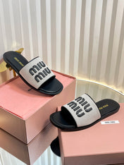 SLIDES SANDALS IN BLACK CALFSKIN AND WHITE STRAW WOVEN