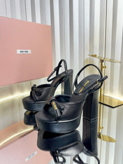 MIUMIU 26S PLATFORM ANKLE STRAP SANDALS 120MM IN BLACK CALFSKIN WITH BOW